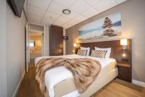 Postel nebo postele na pokoji v ubytování Fletcher Hotel-Restaurant Arneville-Middelburg
