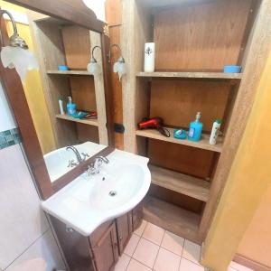 a bathroom with a sink and a mirror at Ulisse sul Sentiero in Praiano