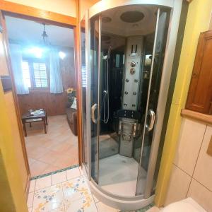 a glass shower in a kitchen with a room at Ulisse sul Sentiero in Praiano