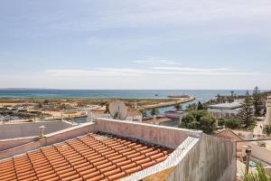 a view of the ocean from the roof of a building at Casa da Avó - City Center - Private Bedrooms in Lagos