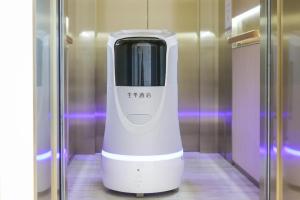 a white hair dryer is sitting in a elevator at Ji Hotel Nanchang Tengwang Pavilion in Nanchang