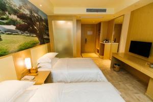 Gulta vai gultas numurā naktsmītnē Starway Hotel Zhenjiang Railway Station