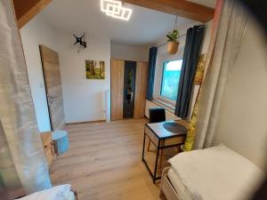 a living room with a couch and a table at HomeW4 Apartment Waldviertel in Hoheneich