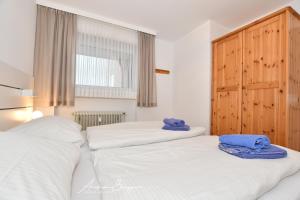 Ένα ή περισσότερα κρεβάτια σε δωμάτιο στο Wohnung "Heike"