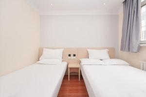 Cama o camas de una habitación en Hi Inn Beijing Zuojiazhuang