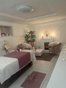 a bedroom with a bed and a fireplace at LACNÉ UBYTOVANIE GABČÍKOVO in Gabčíkovo +47 photos