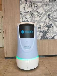 an electronic device is sitting on a floor at Hanting Hotel Nanyang Railway Station in Nanyang