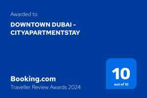 a blue sign with the words downtown dublin city apartment warranty at Downtown Dubai - CityApartmentStay in Dubai