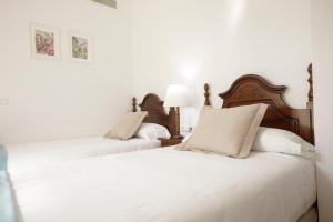 Postel nebo postele na pokoji v ubytování Hotel San Miguel