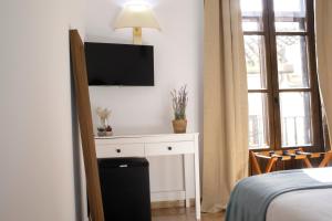 TV a/nebo společenská místnost v ubytování Hotel San Miguel