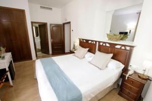 Postel nebo postele na pokoji v ubytování Hotel San Miguel