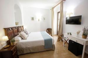 Postel nebo postele na pokoji v ubytování Hotel San Miguel
