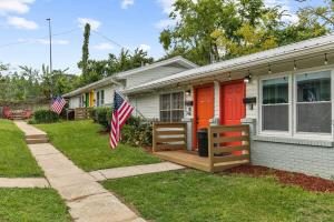 a house with a porch with an american flag at The Bricks - Apt 1 in Birmingham