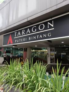 a sign on the front of a building at Taragon Condominiums- KL in Kuala Lumpur