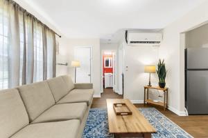 a living room with a couch and a table at The Bricks - Apt 2 in Birmingham