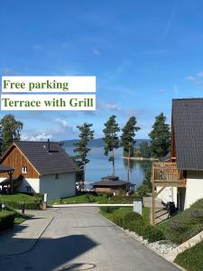 a street with houses and the words free parking terrace with gritt at Lipno Village Houses in Frymburk