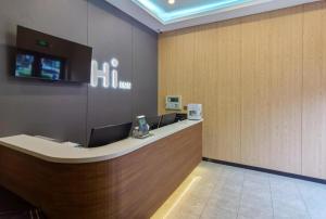 a lobby with a reception desk in a building at Hi Inn Beijing Chaoyangmen in Beijing