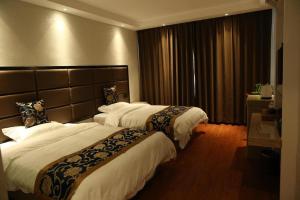 מיטה או מיטות בחדר ב-Elan Boutique Hotel Wenzhou Longwan Haicheng