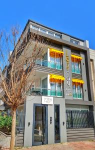 a building with a sign in front of it at Letstay Sweet Home Yellow in Antalya