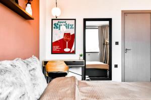 a bedroom with a bed and a desk and a mirror at 4 Bdr 2 Bth Netflix Panorama Views in Sofia