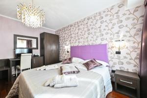 Ein Bett oder Betten in einem Zimmer der Unterkunft Hotel Mastrodattia