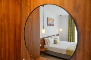 Ένα ή περισσότερα κρεβάτια σε δωμάτιο στο Antheon Apartment 2