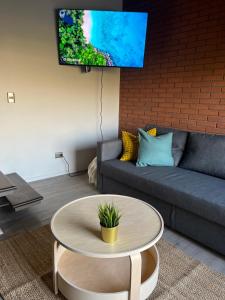 a living room with a couch and a coffee table at NR apart in Santiago