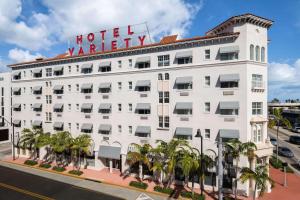 a white hotel with a sign on top of it at The Variety by LuxUrban, Trademark Collection by Wyndham in Miami Beach