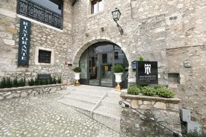 an entrance to a building with a sign on it at Hotel Mastrodattia in Celano