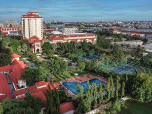 an aerial view of a city with a resort at Sofitel Phnom Penh Phokeethra in Phnom Penh