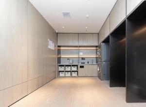 a walk in closet with stainless steel cabinets at Ji Hotel Suqian Sucheng District Government in Suqian