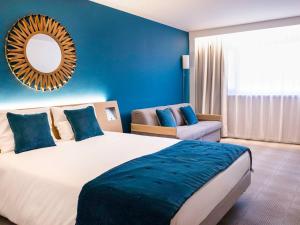 Postel nebo postele na pokoji v ubytování Novotel Avignon Nord