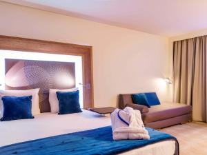 Postel nebo postele na pokoji v ubytování Novotel Avignon Nord