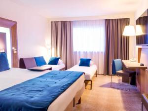 Postel nebo postele na pokoji v ubytování Novotel Avignon Nord