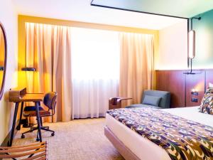Postel nebo postele na pokoji v ubytování Novotel Avignon Nord