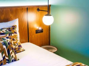 Postel nebo postele na pokoji v ubytování Novotel Avignon Nord