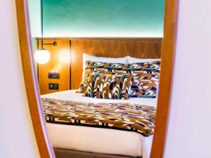 Postel nebo postele na pokoji v ubytování Novotel Avignon Nord