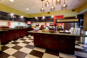 a fast food restaurant with a counter in a room at Hampton Inn Flemington in Flemington