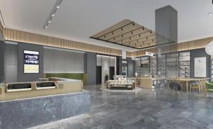 a rendering of a lobby with tables and chairs at Ji Hotel Zhenjiang Railway Station Nan Square in Zhenjiang