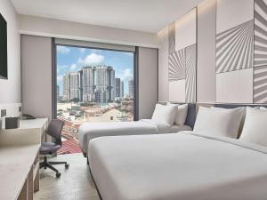 Postel nebo postele na pokoji v ubytování Mercure ICON Singapore City Centre + 24 fotografií