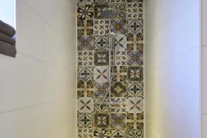 a bathroom with a shower with tiles on the wall at Tenne in Rietz Neuendorf