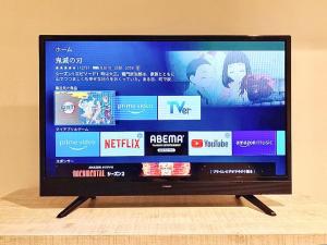 En tv och/eller ett underhållningssystem på YOUR ROOM Kumamoto Station Little