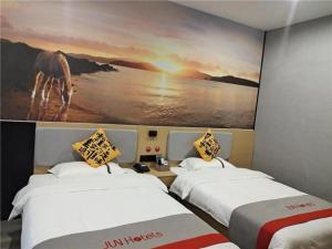 Krevet ili kreveti u jedinici u okviru objekta Jun Hotel Jiangxi Ji'an Xiajiang County Yuxia Avenue
