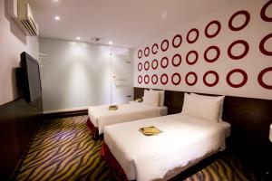 Postel nebo postele na pokoji v ubytování Moshamanla Hotel - Ximen + 20 fotografií