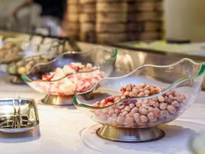 a group of bowls of food on a table at Lavande Hotel Nanchong Xihua Shida in Nanchong