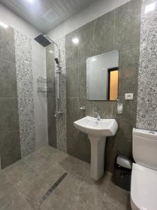 a bathroom with a sink and a toilet at Amroc Hotel - Հյուրանոց Ամրոց in Noyemberyan +29 photos