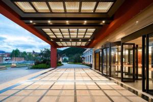 an empty hallway of a building with awning at Tanshan Hotel in Shangri-La