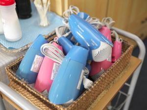 a basket on a table with blue and pink items at Omura Yasuda Ocean Hotel in Imazugō