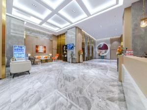 a lobby of a hotel with a marble floor at Poltton International Service Apartment Jieyang Qiaonan Yudu in Jieyang