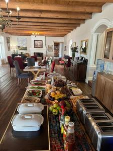 a buffet of food on a table in a living room at Banhoek Corner Guesthouse in Stellenbosch